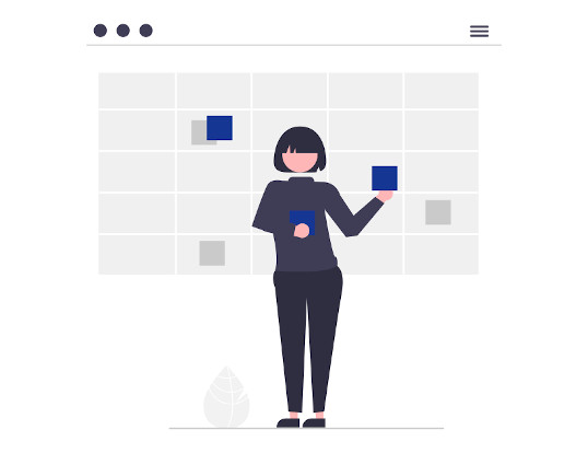 A woman in front of a visual kanban board