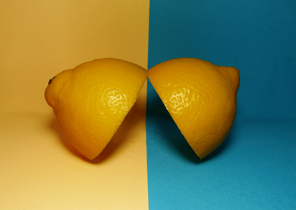 A Comparative Breakdown of Kanban and Scrum: Choosing the Right Fit for Your Workflow Two halves of a lemon on various backgrounds signal a duality