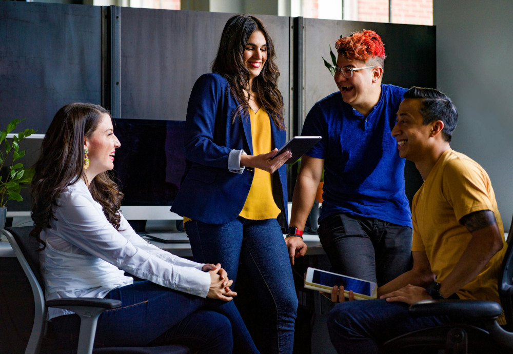 Mastering Kanban means learning to see and present A happy team at an office