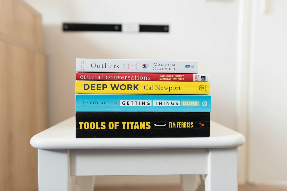 A set of productivity and time management techniques books sitting on a chair