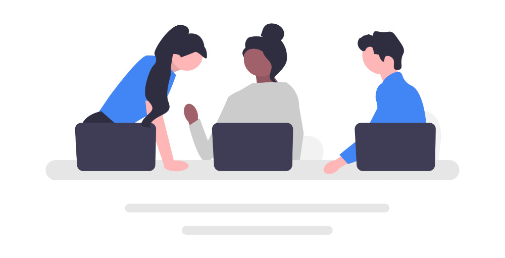 Each team has unique needs Team in discussion at a table with laptops