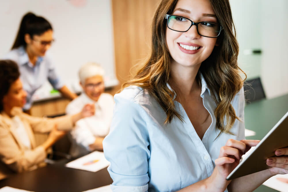 A manager looks content with her team's progress