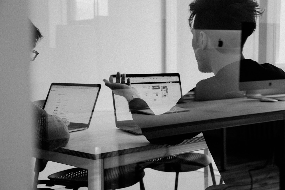 Visual Tracking Helps Anticipate and Defuse Issues Colleagues working on laptops